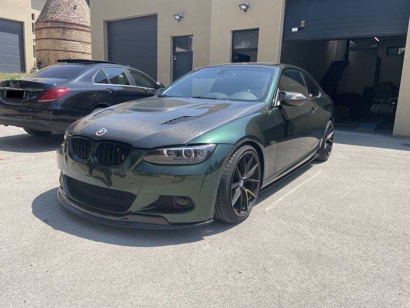 Total Covering brillant Midnight Green sur BMW 335i proche de Villefranche sur Saône