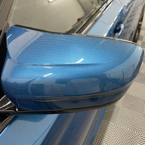 Rétroviseur BMW M550 G31 protégé par film de protection carrosserie PPF intégral chez AM Covering Lyon